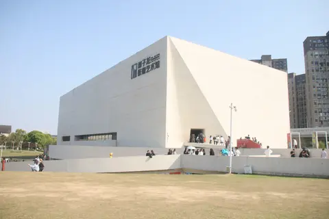 The white angular building of the Xie Zilong Photography Museum