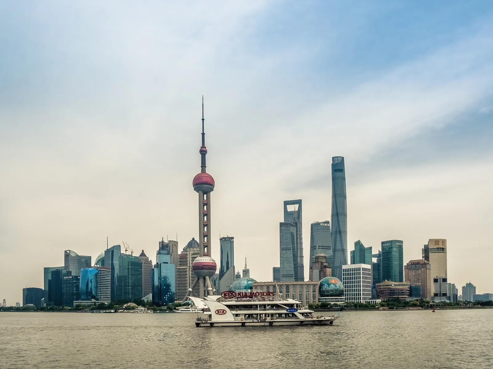 The Oriental Pearl Tower and Pudong skyline across the Huangpu River