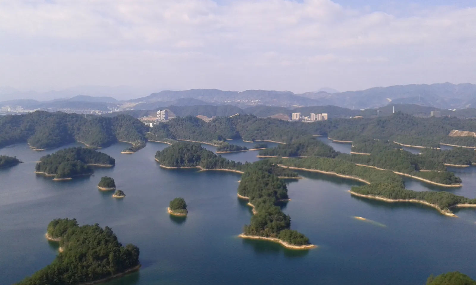 Green islands scattered across Qiandao Lake seen from a hilltop