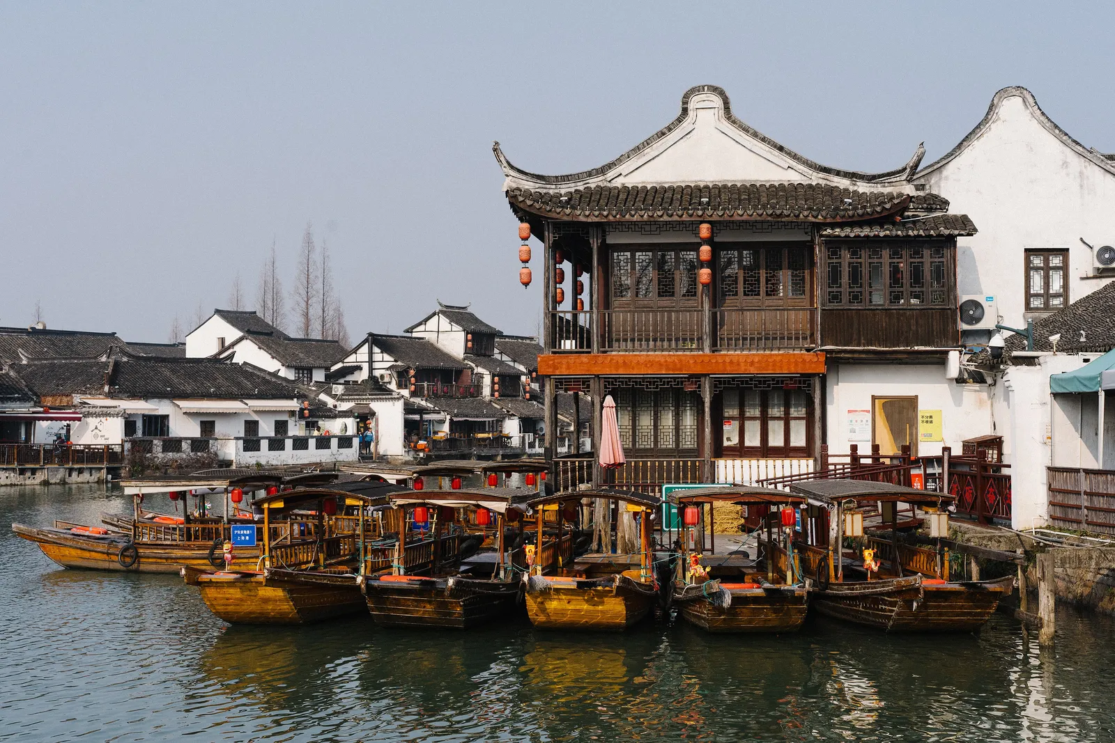 Canal, tour boats and old waterfront houses in Zhujiajiao
