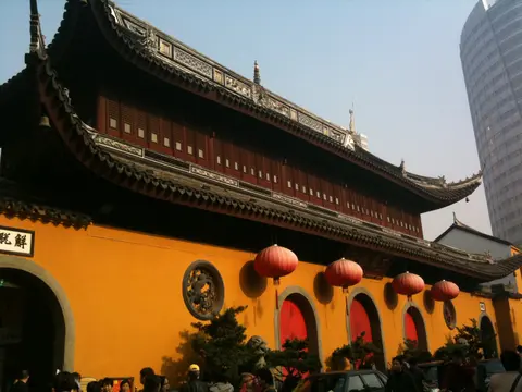 Yellow walls, lanterns and sweeping eaves of the Jade Buddha Temple