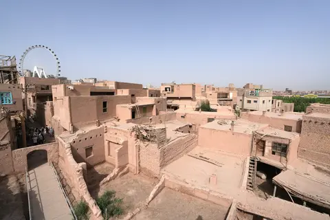 Mud-brick rooftops and lanes of the Gaotai old residences on their loess cliff