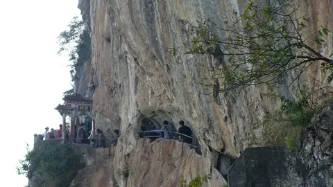 The Dragon Gate path carved into the sheer cliff of the Western Hills