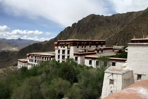 Drepung Monastery's white buildings on the mountainside