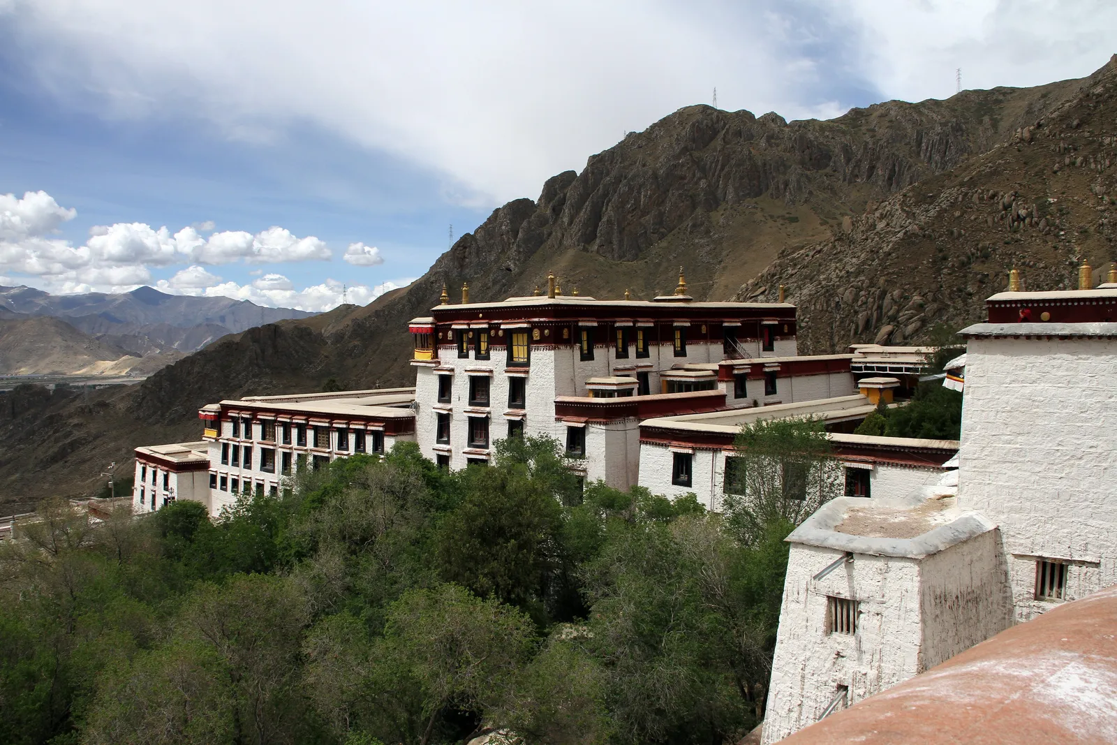 Drepung Monastery's white buildings on the mountainside