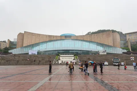 The curved facade and glass dome of the Three Gorges Museum
