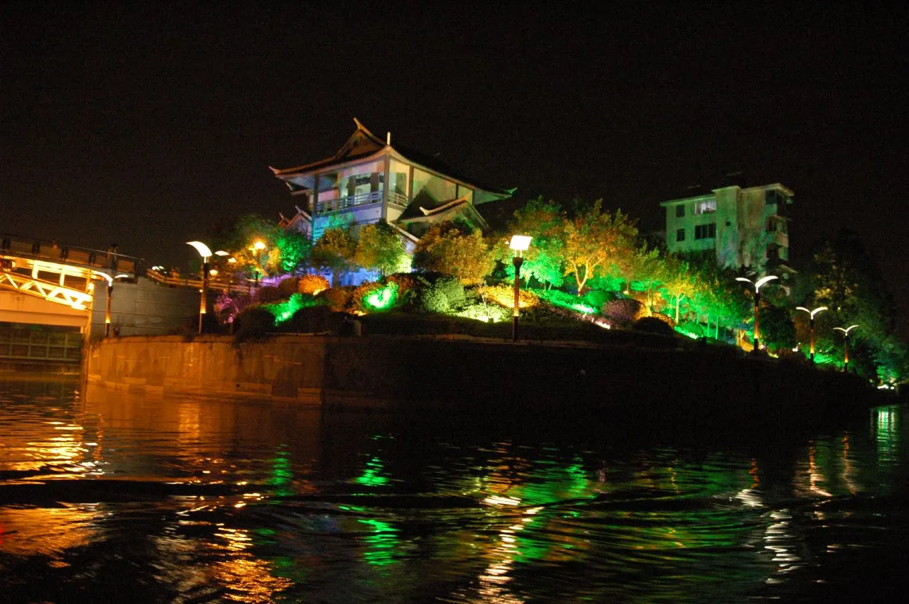 Illuminated pavilion reflected in the water on the Two Rivers and Four Lakes route