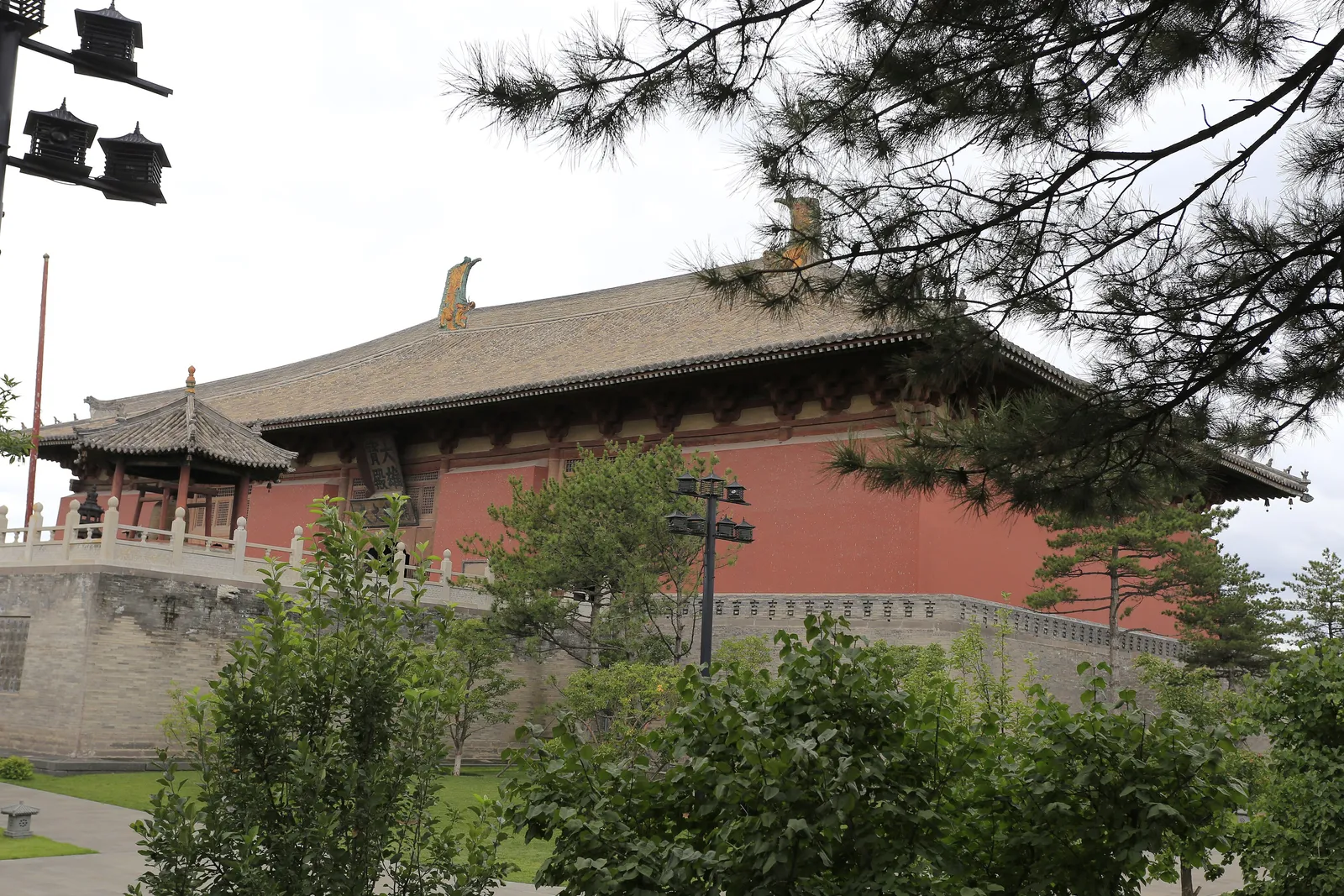 The Mahavira Hall of Huayan Temple seen through pine branches