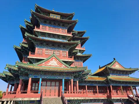 Yuejiang Tower’s tiers of upturned eaves on Lion Hill under blue sky