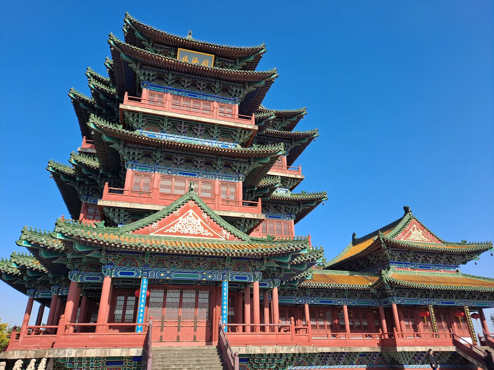 Yuejiang Tower’s tiers of upturned eaves on Lion Hill under blue sky