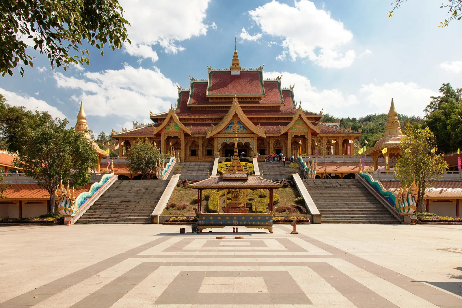 Gilded Dai-style halls of the Mengle Grand Buddhist Temple in Jinghong