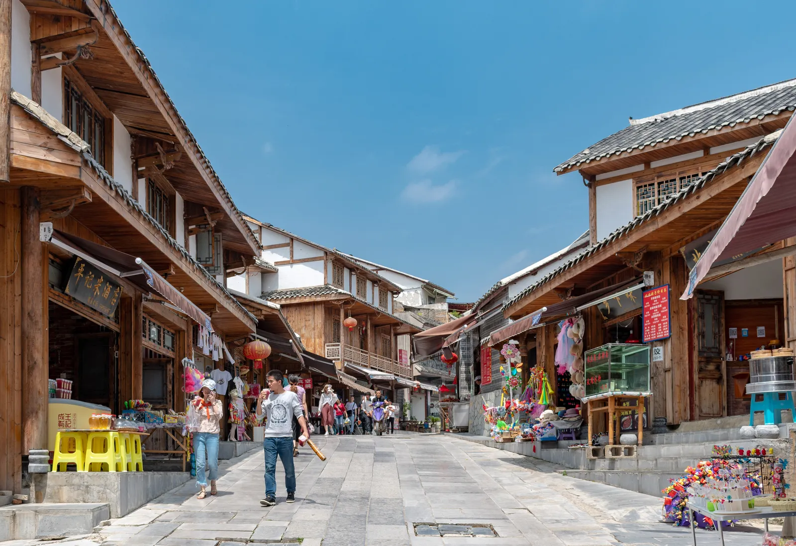 Stone-paved main street of Qingyan Ancient Town lined with wooden shopfronts