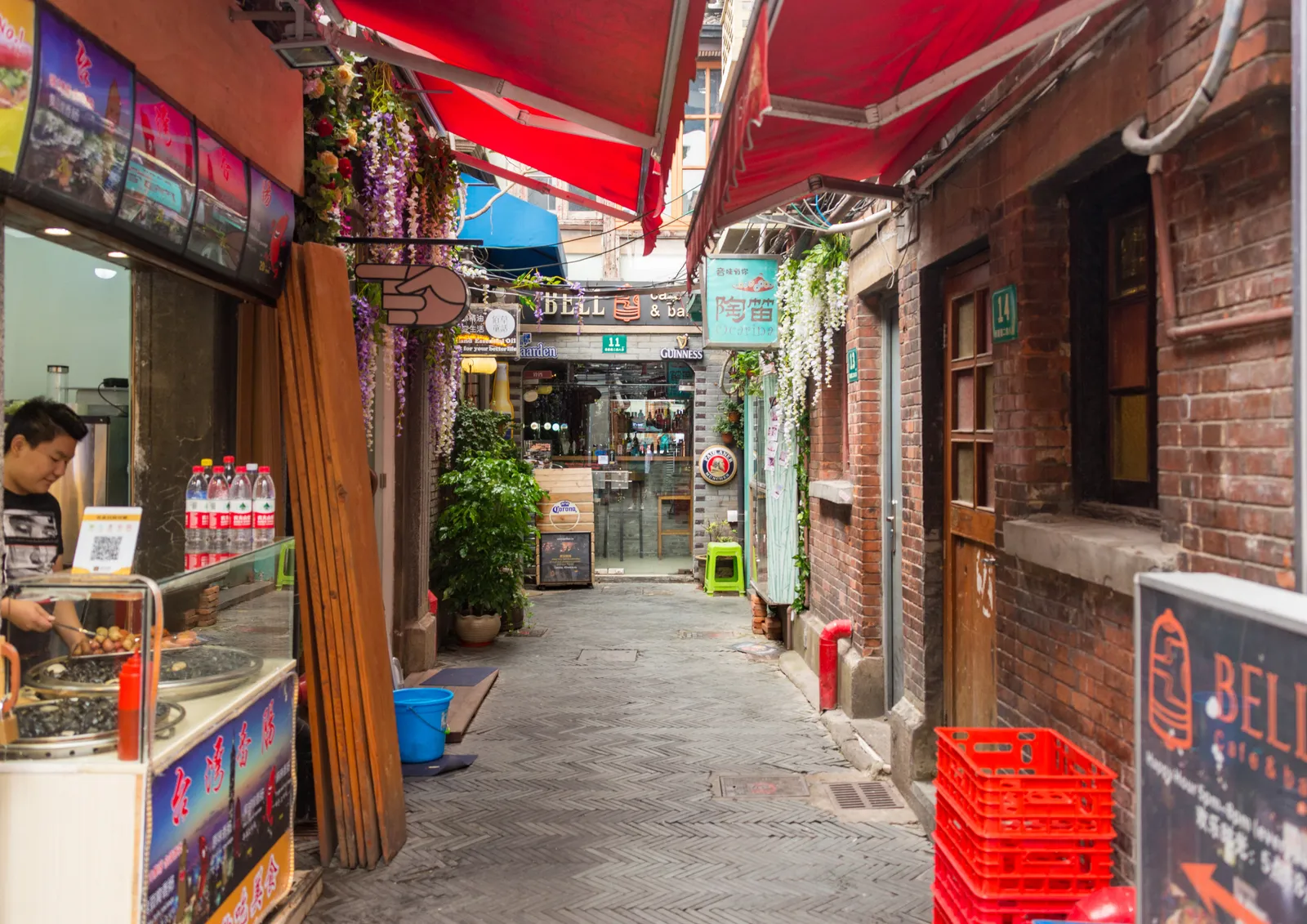 A narrow brick lane of shops and cafés in Tianzifang
