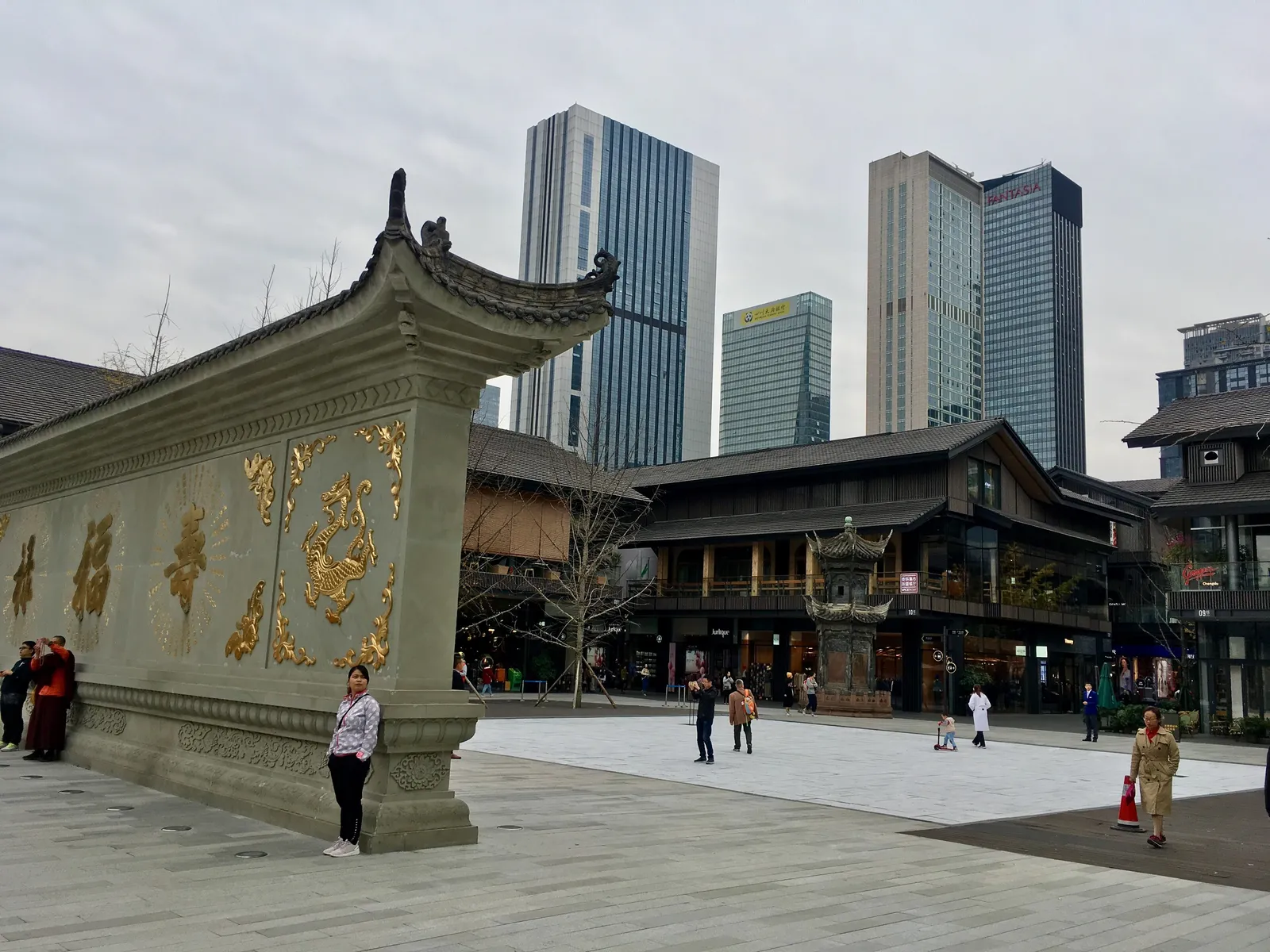 Screen wall and low wooden buildings of Taikoo Li beside Daci Temple