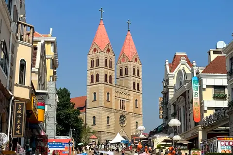 The twin spires of St Michael's Cathedral above old Qingdao streets