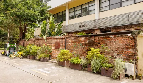 Converted factory buildings and planted brick walls at OCT Loft