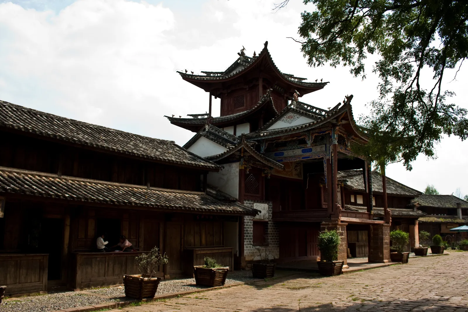 Old theatre stage and wooden houses on Sideng Square in Shaxi