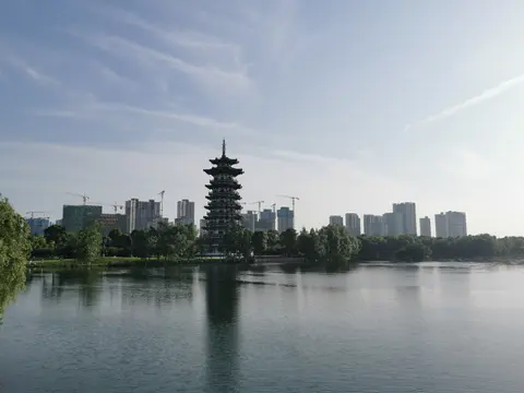 The Egret Tower rising over the lake in Yanghu Wetland Park