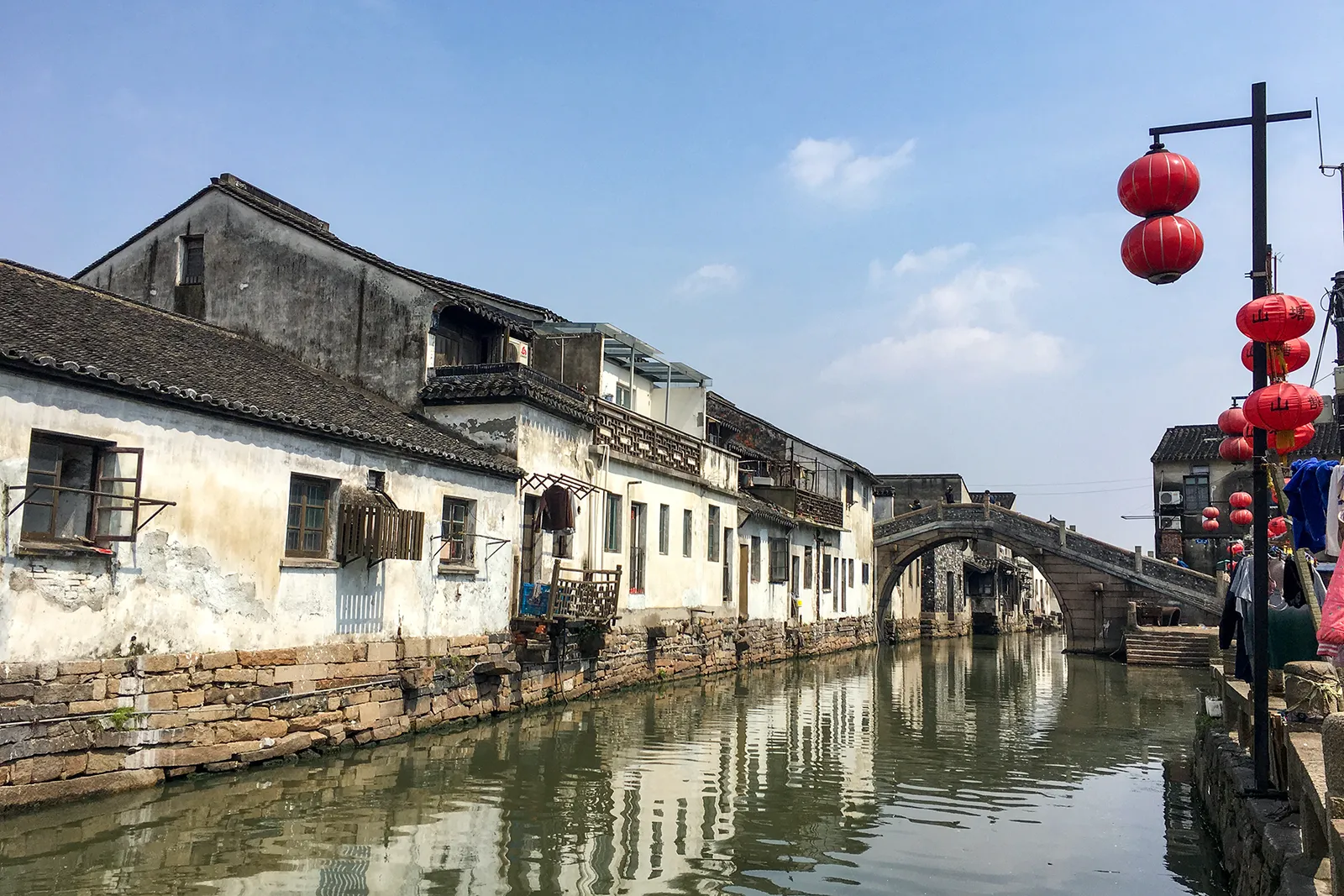Whitewashed houses and stone bridge along the Shantang canal