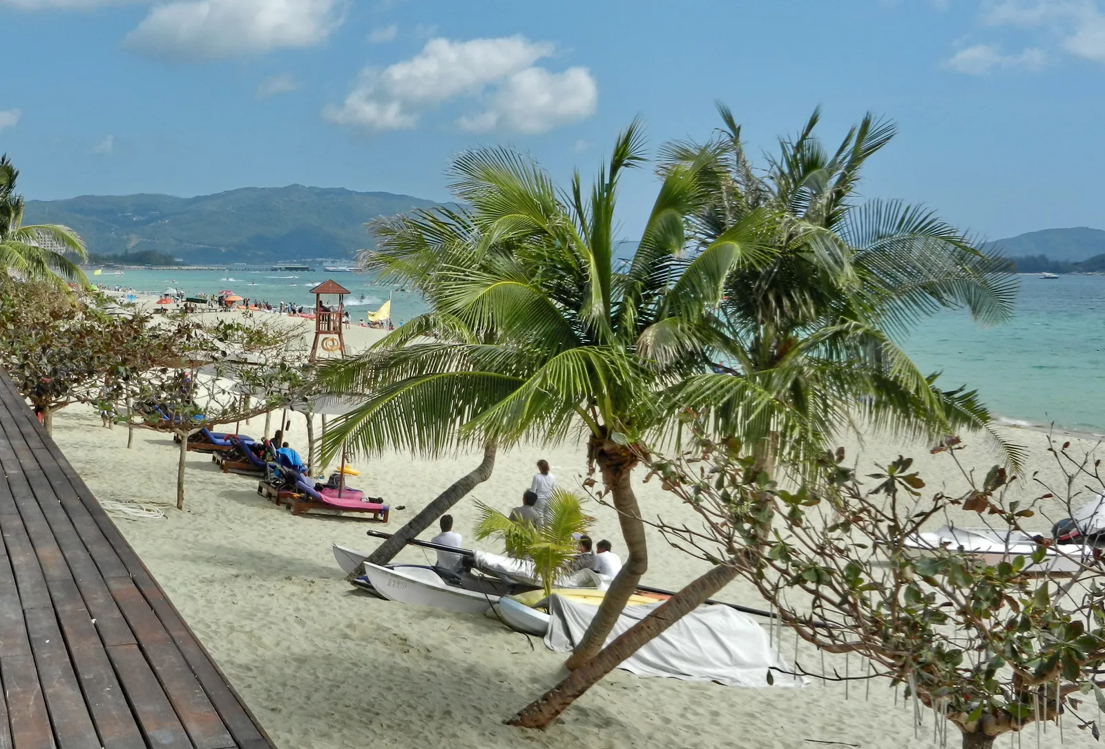 Palm trees and white sand along Yalong Bay beach