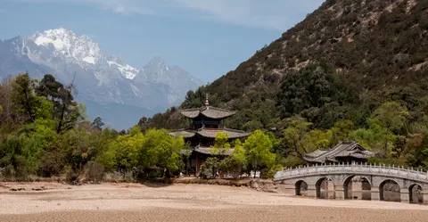 Black Dragon Pool's pavilion and bridge with Jade Dragon Snow Mountain behind