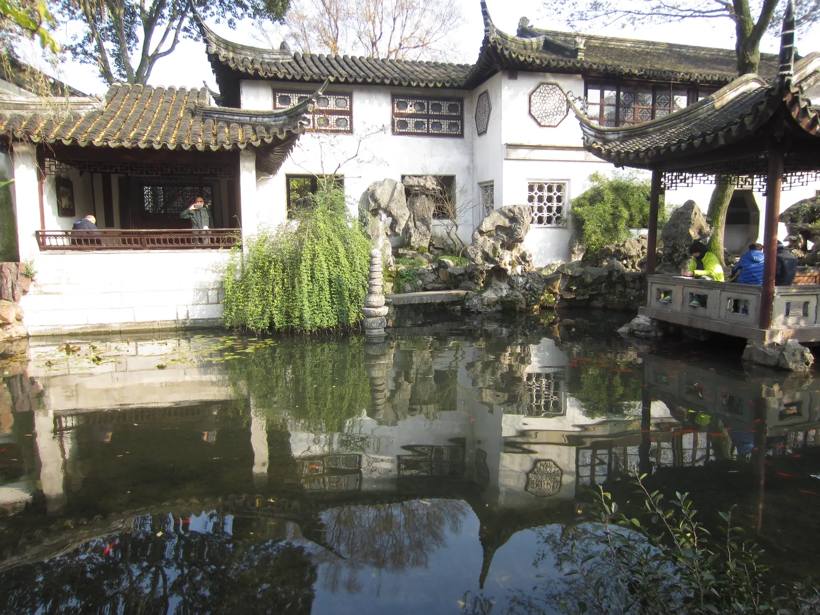 Pond, willows and white-walled halls in the Lingering Garden