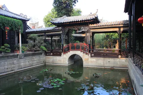 Lotus pond, arched bridge and halls in Yuyin Shanfang garden, Panyu