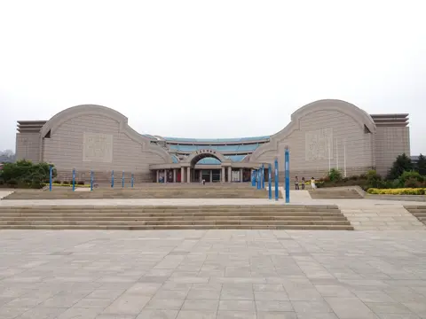 The curved stone facade of the Qingdao Museum