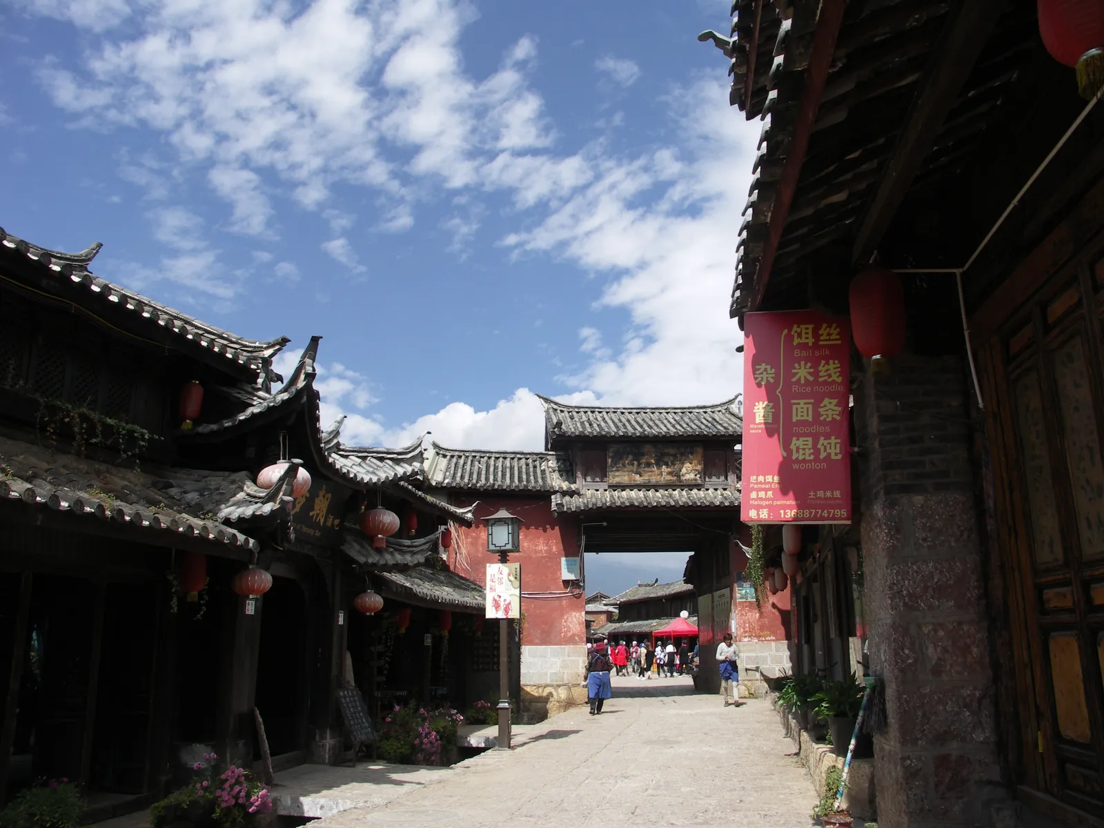 Quiet stone-paved street of old Naxi houses in Baisha