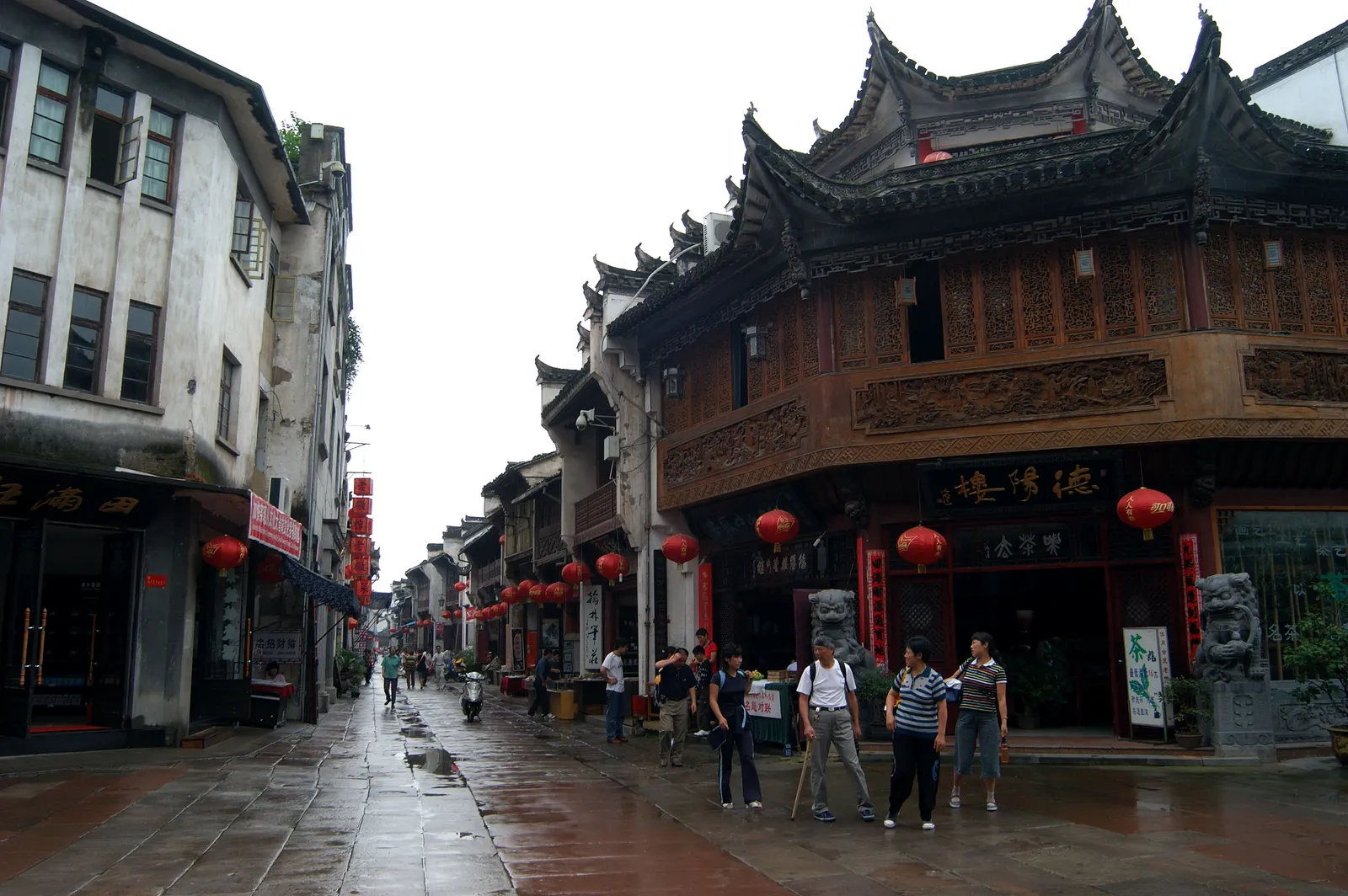 Shops with carved wooden fronts along Tunxi Old Street