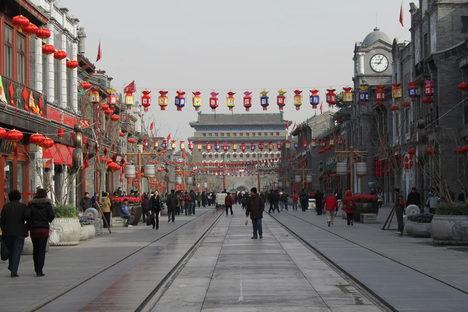 Pedestrian Qianmen Street lined with lanterns, looking toward Qianmen Gate