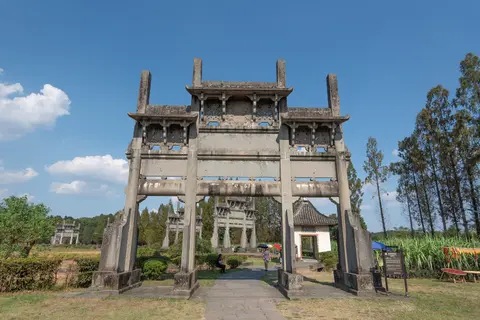 Carved stone memorial archways standing in a row at Tangyue, Shexian