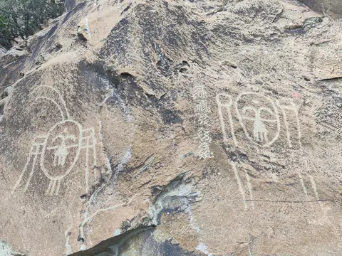 Ancient carvings of figures on a boulder at Helankou, Helan Mountains