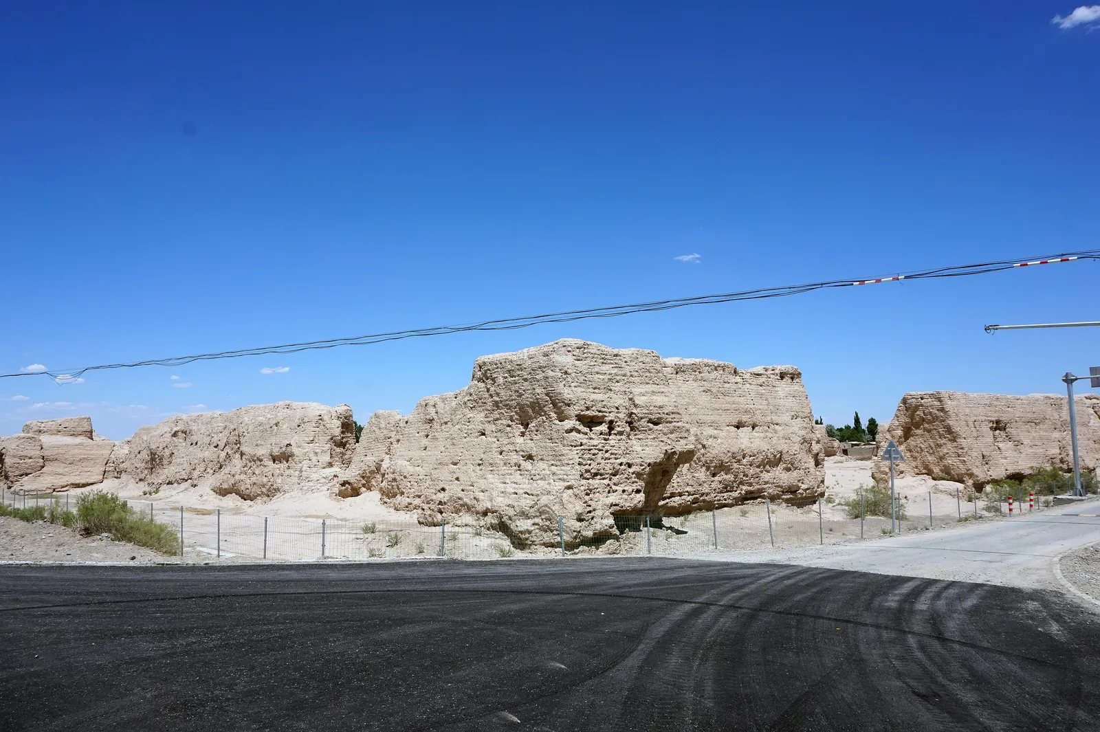 Crumbling rammed-earth walls of the Pochengzi city ruins near Guazhou