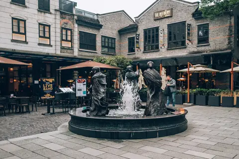 Shikumen-style buildings and fountain sculpture in Xintiandi
