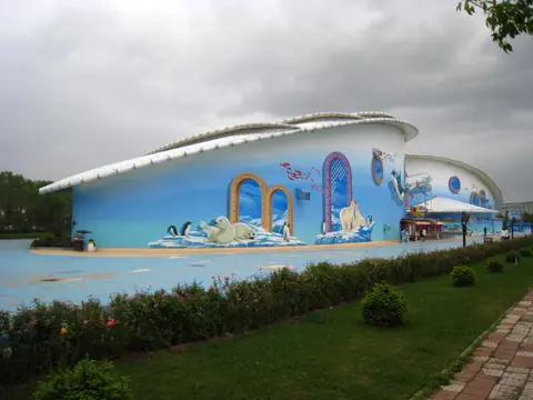 Ocean-themed murals on the Polarland building in Harbin