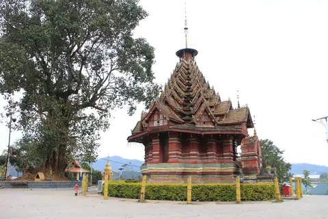 The tiered, many-gabled roof of the Jingzhen Octagonal Pavilion in Menghai