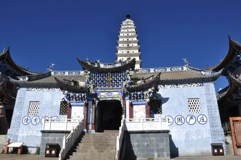 Jinding Temple and its white pagoda on the summit of Jizu Mountain