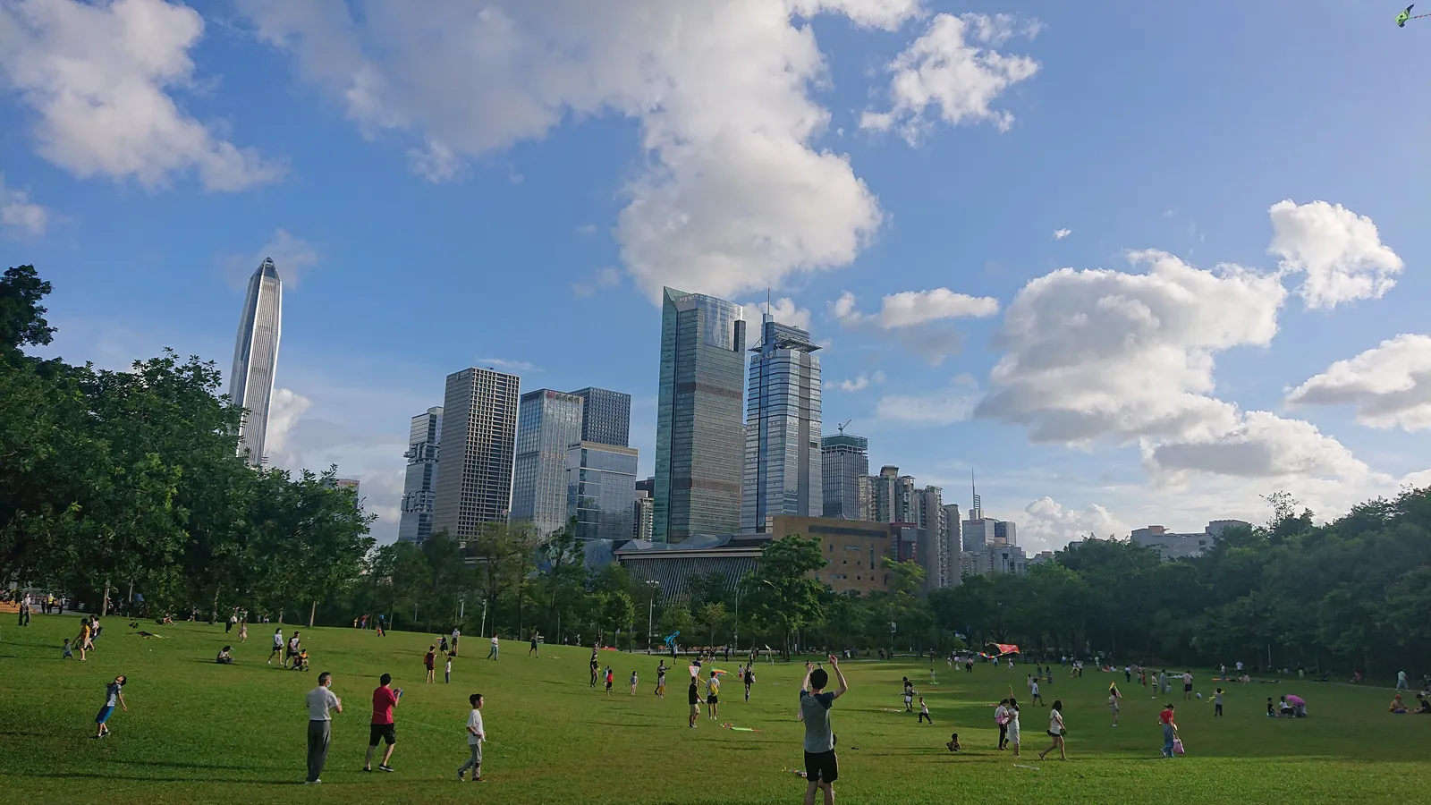 The big lawn of Lianhuashan Park with the Futian skyline behind