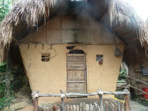 A traditional thatched Li dwelling in Ganza Village, Betel Nut Valley