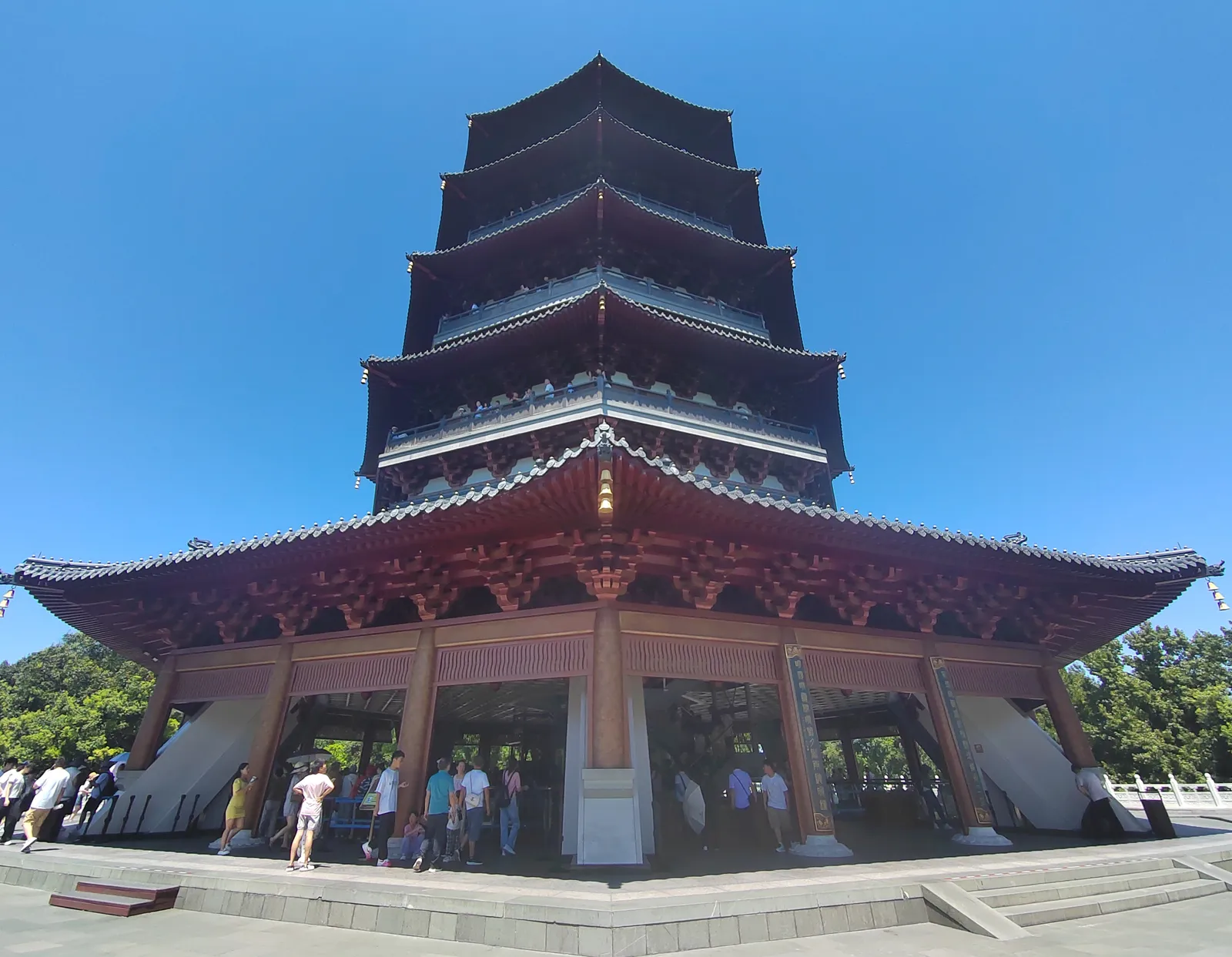 Leifeng Pagoda's tiered roofs against a blue sky