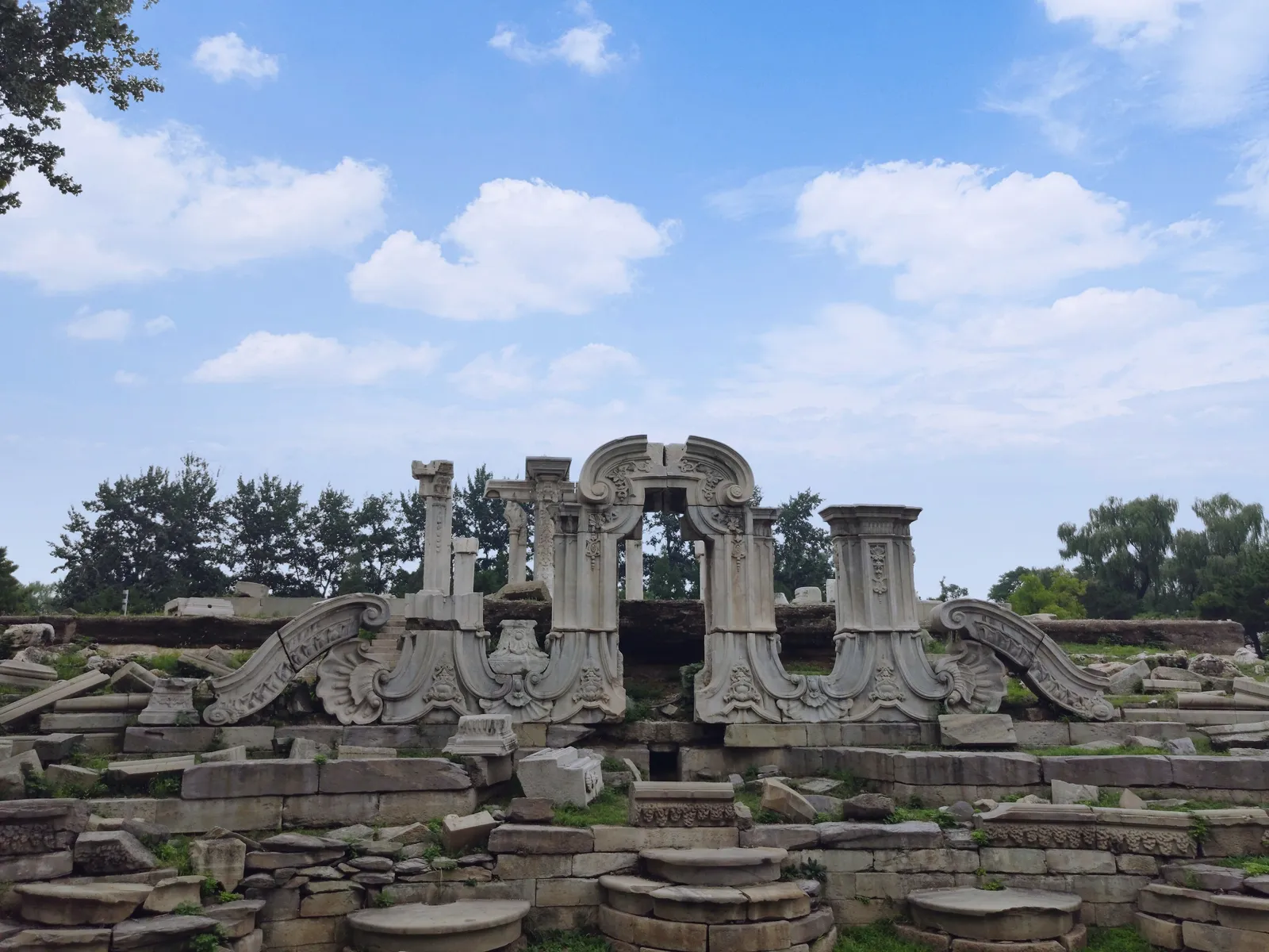 Carved stone ruins of the Dashuifa fountain at the Old Summer Palace