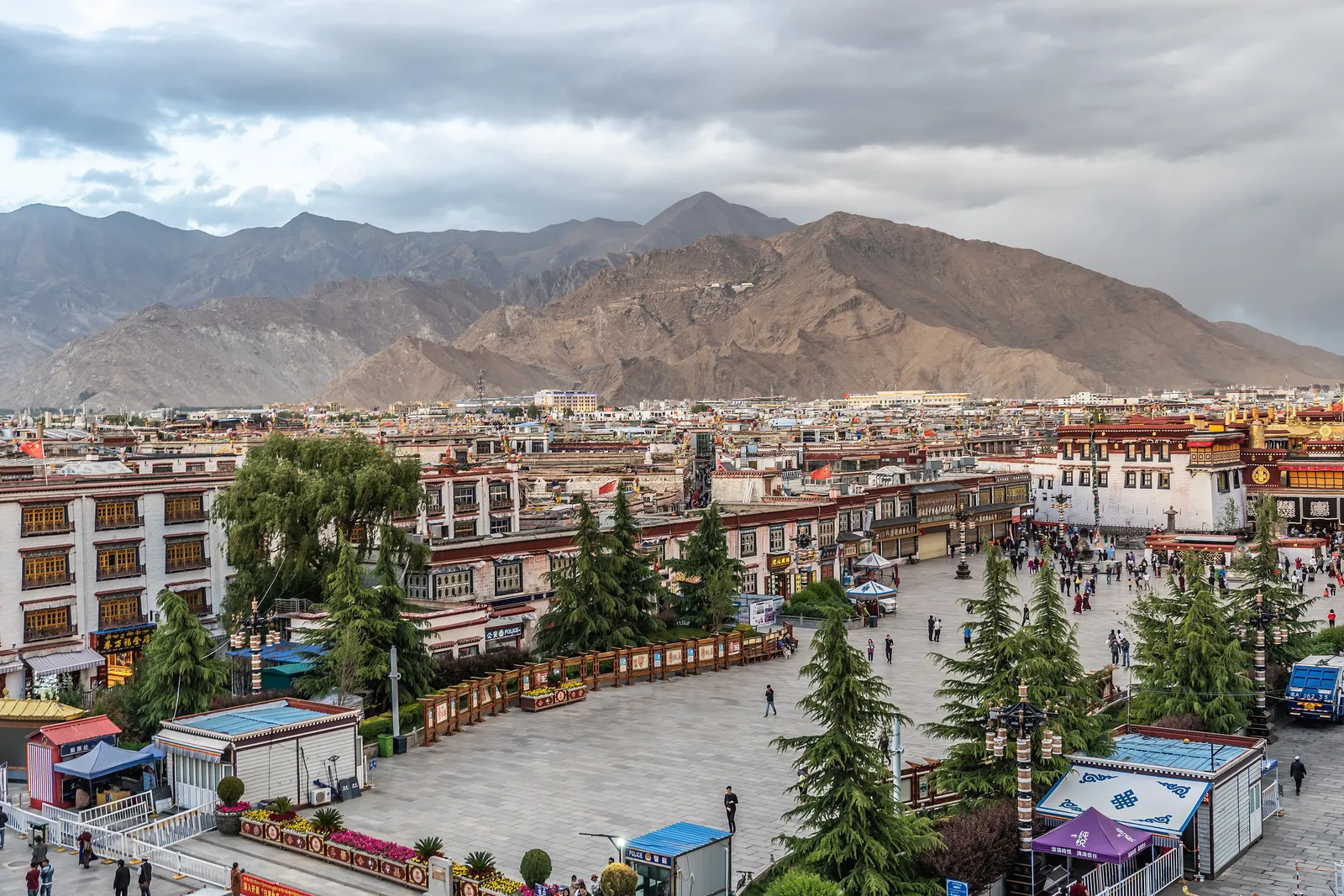 Barkhor Square and old Lhasa rooftops with mountains behind