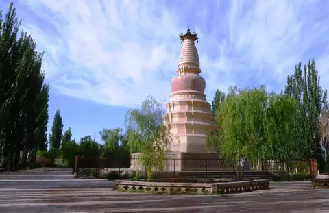 The whitewashed tiered White Horse Pagoda in Dunhuang