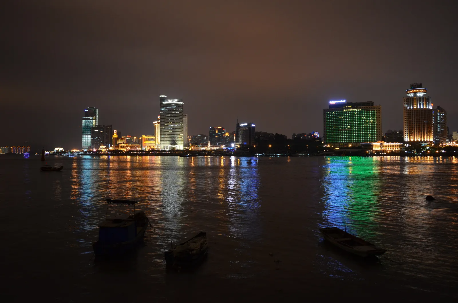 Xiamen's Lujiang waterfront lit up at night, seen across the strait from Gulangyu