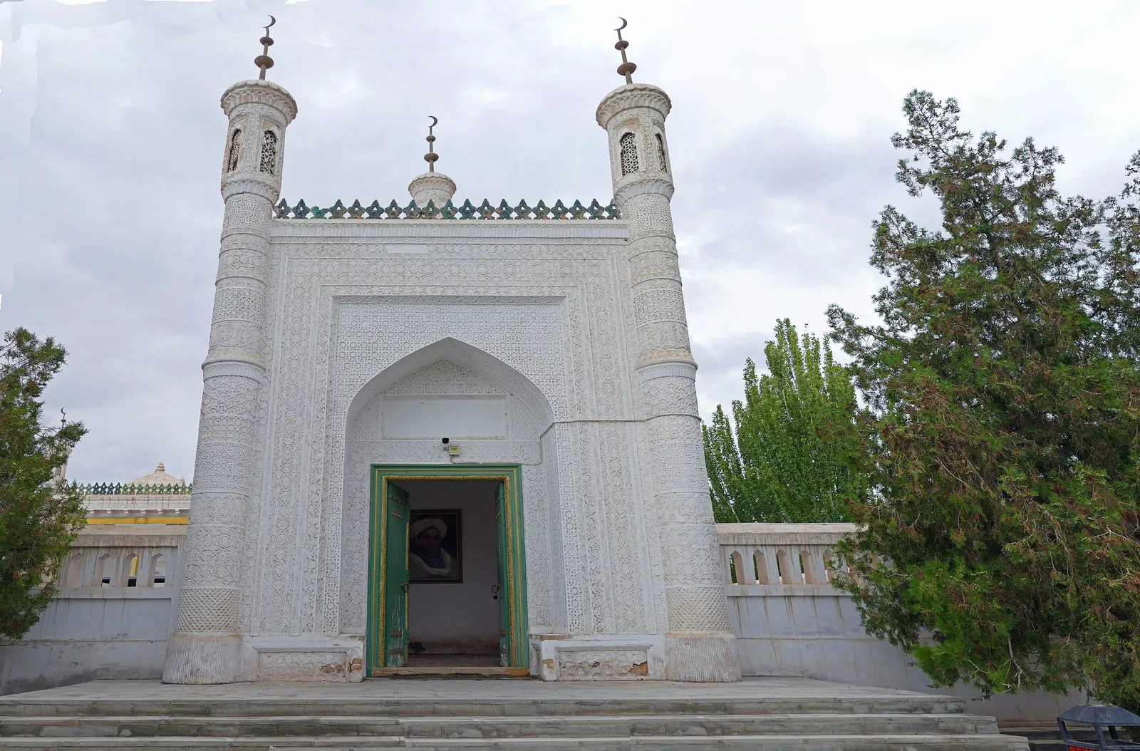 The white entrance gate of the Mausoleum of Mahmud Kashgari at Upal