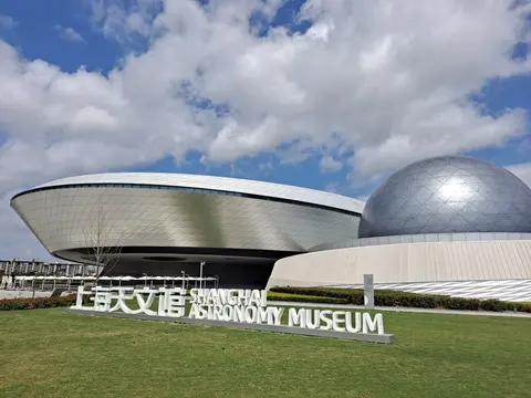 The silver dome and curved halls of the Shanghai Astronomy Museum