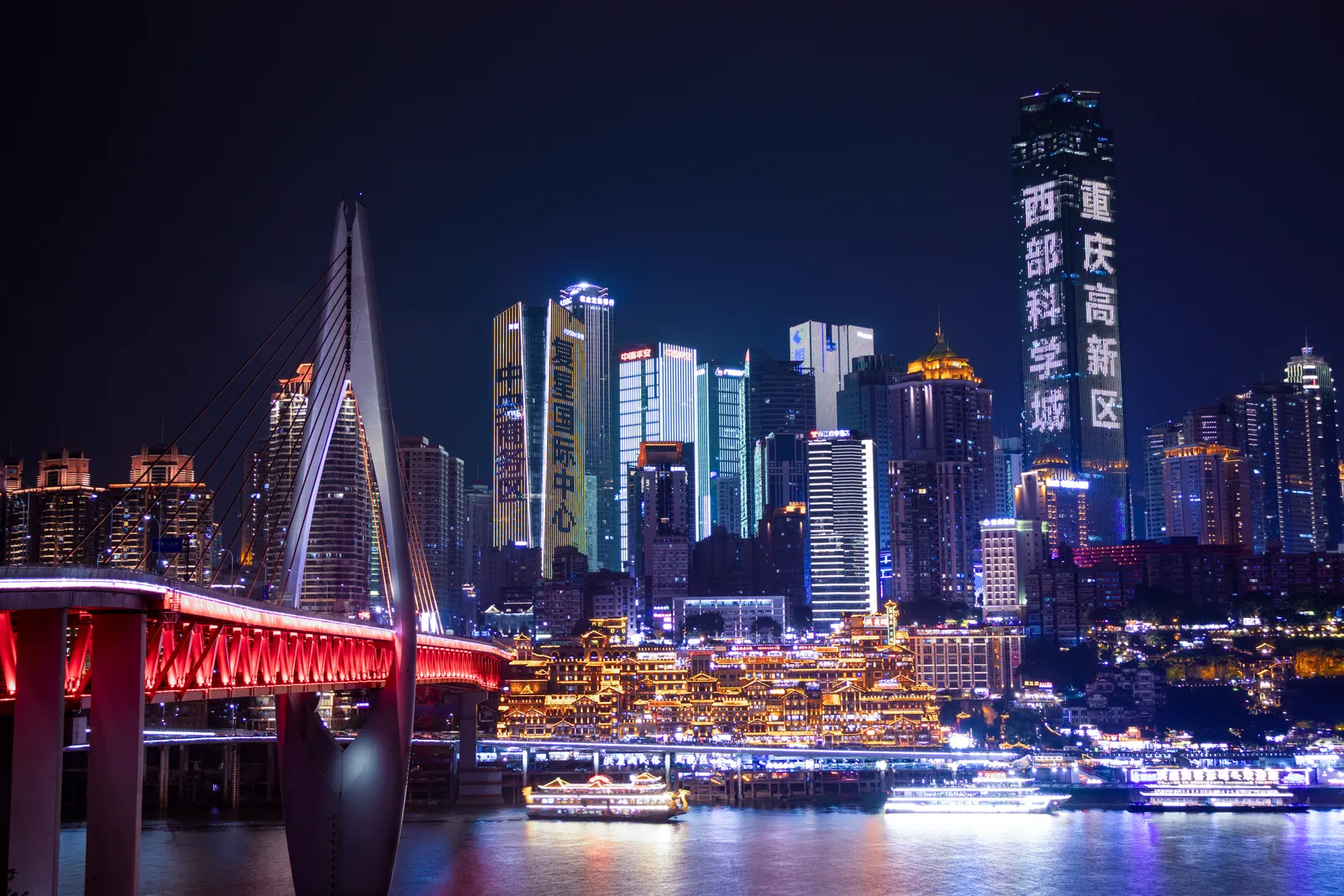 Chongqing’s lit-up skyline and Hongyadong over the Jialing River at night