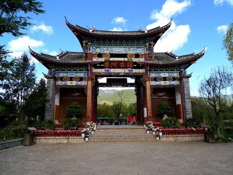 Carved wooden gateway at the entrance to Shuhe Old Town