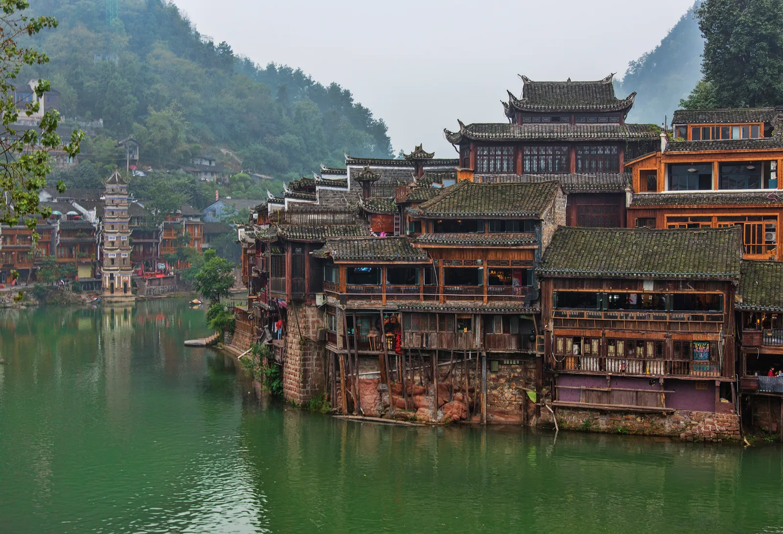 Stilt houses and a pagoda along the Tuo River in Fenghuang Ancient Town